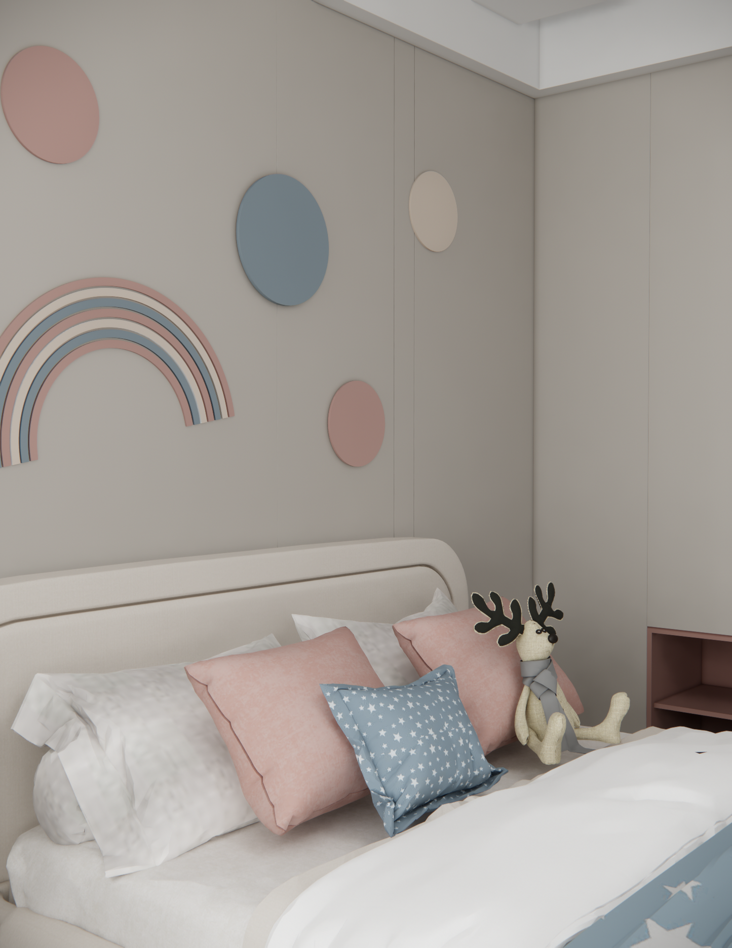 Children's bedroom with colorful wall decorations, pillows, and a toy on a bed.
